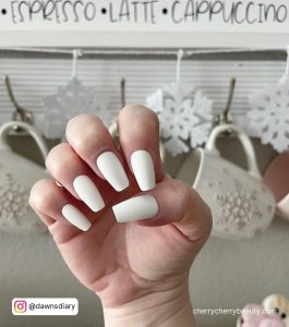 White Matte Acrylic Nails In Front Of Mugs