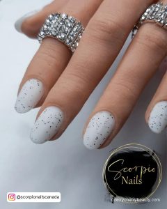 White Matte Nails With Glitter For A Cute Look