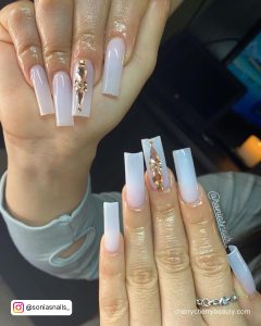 White Nails With Gold Rhinestones On Middle Finger