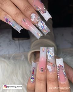 White Nails With Rhinestones In The Shape Of Butterflies