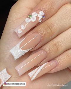 White Nails With Rhinestones On One Finger For An Elegant Look