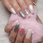 White Nails With Silver Glitter And Diamonds On Middle Finger