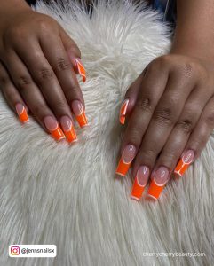 White Outline Nail Design With Orange Tips