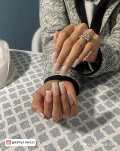White Outline Nails On A Table