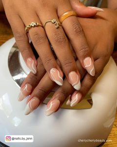 White Swirl Almond Nails Paired With Rings