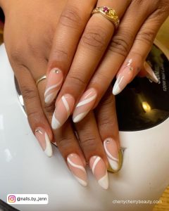White Swirl Almond Nails With Diamonds On Two Fingers