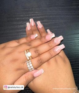 White Swirl Nails Coffin On A Black Surface
