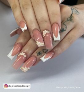 White Tip Nails With Flower On Nude Pink Nail Paint