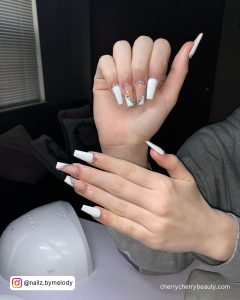 White Tips With Rhinestones On Two Fingers