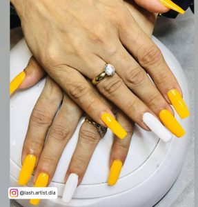 Yellow And White Nail Ideas With Ring In One Finger