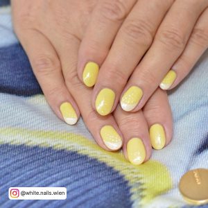 Yellow White Ombre Nails On A Multi Colored Surface
