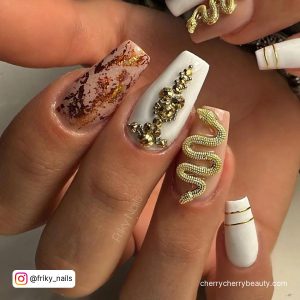 Acrylic Gold Nails With Stones And Snake Design