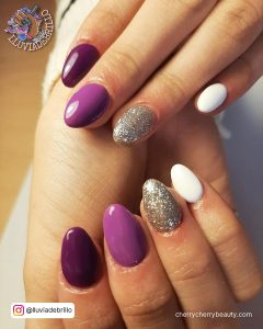 Acrylic Nails Purple And Silver With Glitter On Ring Finger