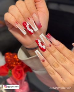 Acrylic Nails Red And Gold With White Flowers