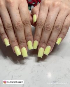 Acrylic Pastel Yellow Nails In Coffin Shape