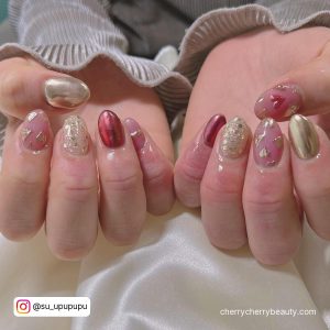 Almond Red And Gold Christmas Acrylic Nails Over Silky Materials