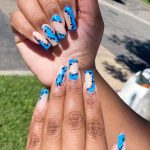 Artsy Summer Blue Acrylic Nails With Green Grass In Background