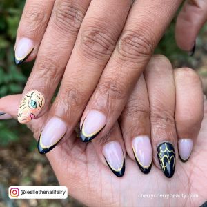 Black And Gold Acrylic Nails Short With A Different Design On Ring Finger
