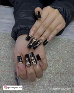 Black And Gold Acrylic Nails With Stones
