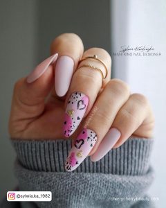 Black And Pastel Pink Nails In Almond Shape
