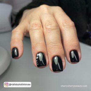 Black Short Nails With Design With Stars On Ring Finger