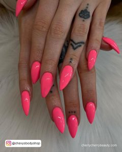 Bright Neon Pink Nails In Stiletto Shape