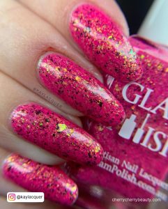Bright Pink Acrylic Nails With Glitter In Almond Shape