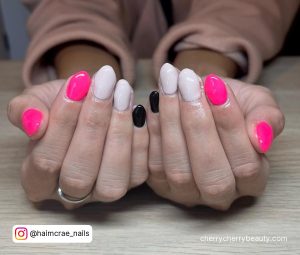Bright Pink And White Nails With Pinky In Black