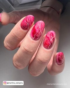 Bright Pink Marble Nails In Almond Shape
