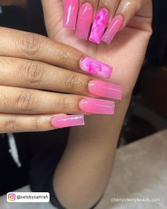 Bright Pink Ombre Nails With Marble Design On One Finger