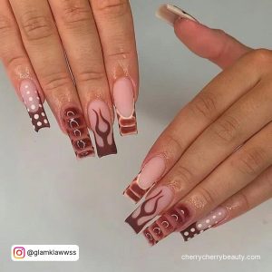 Brown Acrylic Nails Ideas With A Different Design On Each Finger