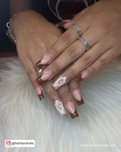 Brown And White Acrylic Nails With Flower Design