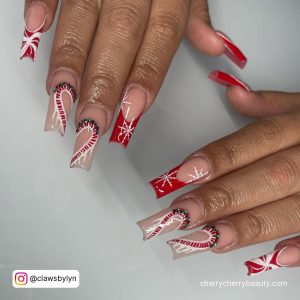 Christmas Candy Came Acrylic Nails Over White Surface