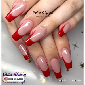Classic Red Tip Acrylic Nails Over White Surface