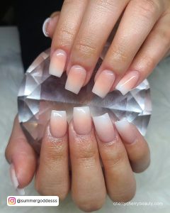 Classy Simple Ombre Acrylic Nails Holding Precious Stone Holding Over White Fur