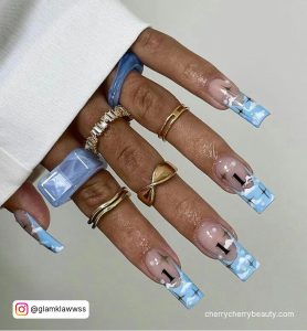Cloudy Light Blue Acrylic Nails Ideas Over White Background