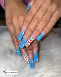 Clown Face Blue Ombre Acrylic Nails Over White Fur