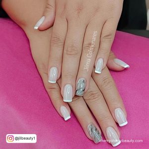 Cute Acrylic Nails French Tip And Marble Design Laying On Pink Clothe