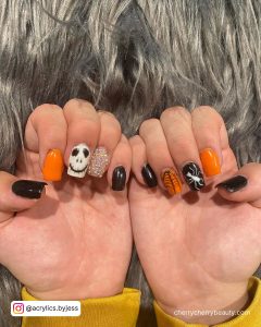 Cute Halloween Acrylic Nails In Black, White, And Orange