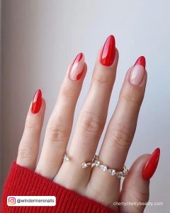 Cute Red Almond Acrylic Nails Over White Background