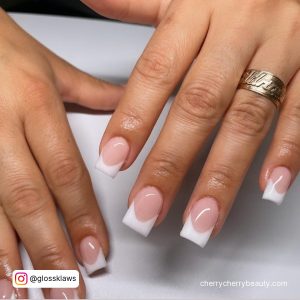 Cute Square French Tip Acrylic Nails Over White Surface