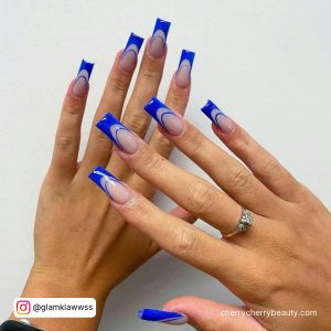 Double French Midnight Blue Acrylic Nails Over White Surface