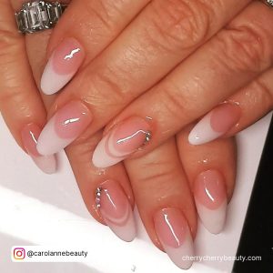 Double French Tips Acrylic Nails With Gems Over White Surface
