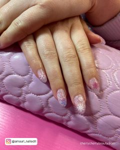 Dreamy Summer Glitter Acrylic Nails On Pink Surface