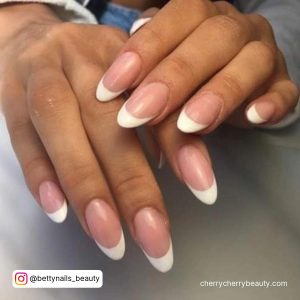 Easy Almond French Tip Acrylic Nails Over White Surface