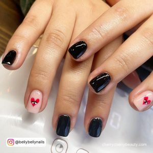 Edgy Short Black Nails With A Heart On Ring Finger