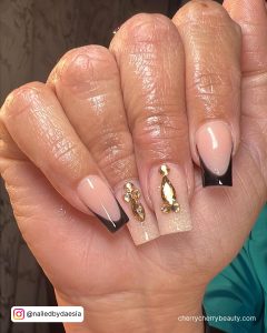 Elegant Black And Gold Nails