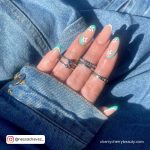 Flowery Almond Acrylic Nails Over Jean Clothe