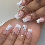 French Acrylic Nails Designs For Christmas With Stones And Crocodile Skin Design On White Surface