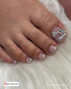 French Tip Acrylic Toe Nails With A Bow On Thumb
